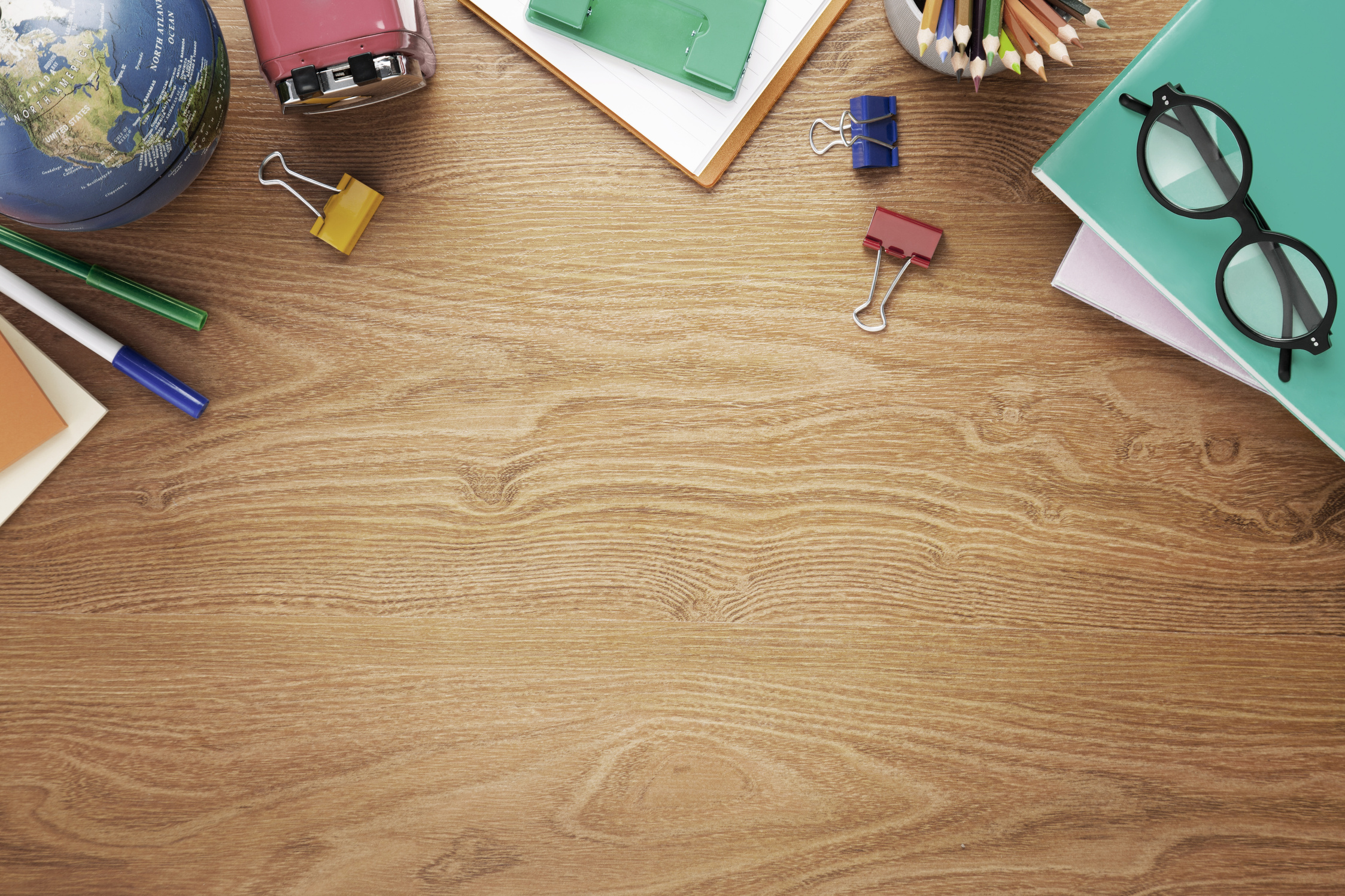 School supplies on desk background with copy space